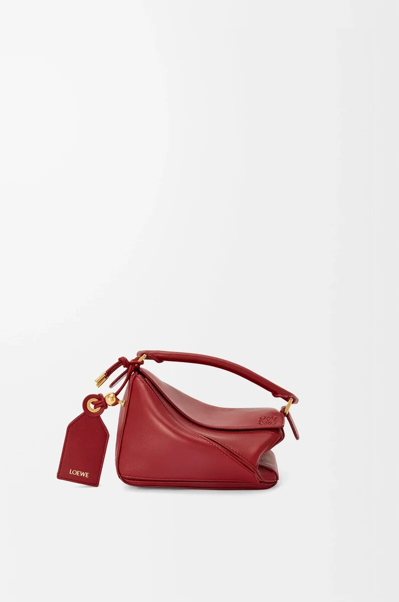 bolso mini featherlight puzzle en piel de cordero napa color rojo quemado